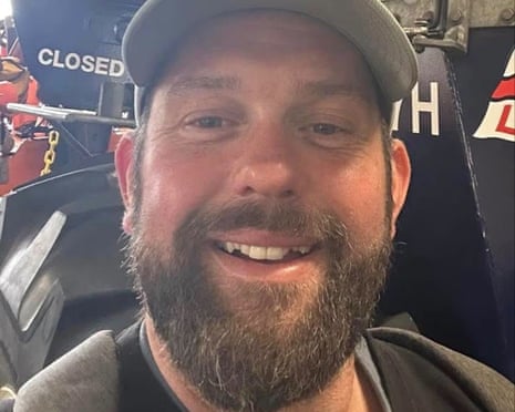 James Desborough, a bearded man wearing a baseball cap, smiles at the camera in a close-up selfie