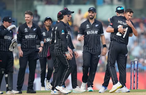 New Zealand's Trent Boult (right) celebrates the wicket of Bangladesh's Towhid Hridoy with his teammates.