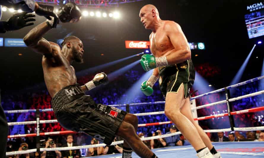 Tyson Fury sends Deontay Wilder sprawling on to the canvas