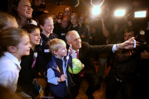 Malcolm Turnbull taking a selfie with a group of children