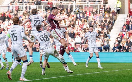 Oisin McEntee heads Hearts’ winner with plenty of Dundee defenders in the area at Tynecastle
