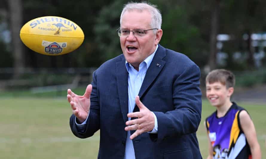 Prime Minister Scott Morrison catches a ball at Norwood Sports Club on Day 34 of the 2022 federal election campaign, in Norwood in Melbourne, in the seat of Deakin. Saturday, May 14, 2022. (AAP Image/Mick Tsikas)