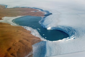 A lake bounded to the left by Washington Land, a deglaciated peninsula that juts into the Kane Basin, and at right by the Humboldt Glacier, Greenland’s widest marine-terminating glacier