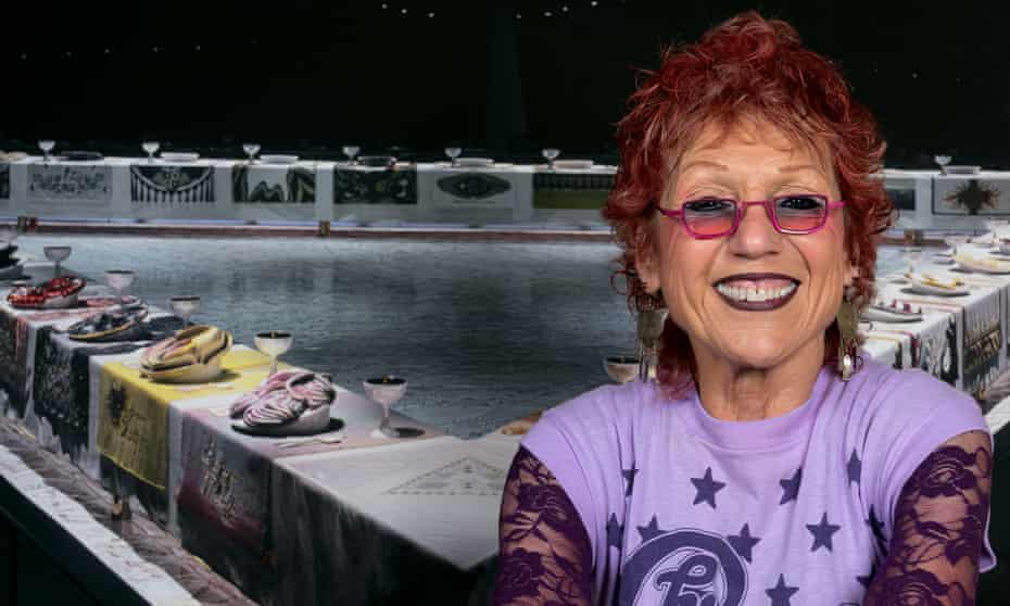 Judy Chicago in front of The Dinner Party