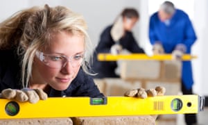 Student using level in bricklaying vocational school
