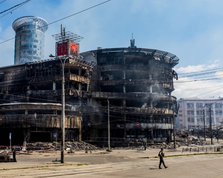 The heavily damaged Kvadrat shopping mall is seen smoldering near Lukianivska metro station in Kyiv following a massive Russian missile strike targeting civilian infrastructure.
