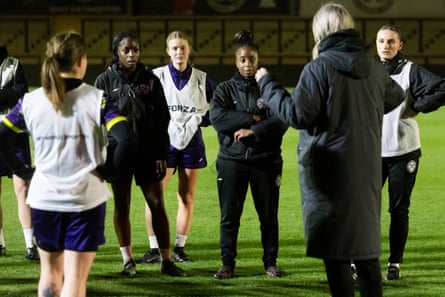 Hazzana Parnell and Remaya Osbourne listen during training