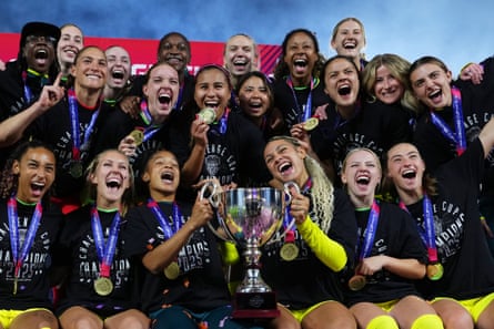 Trinity Rodman and her Washington Spirit and teammates celebrate with the trophy after winning the the 2025 NWSL Challenge Cup over the Orlando Pride in March.