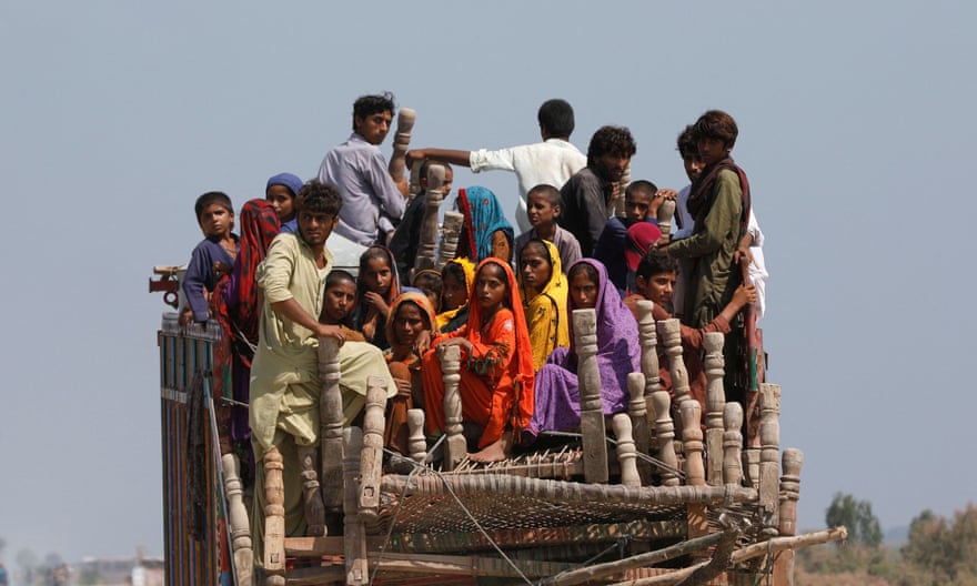 People crowded on to truck