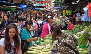 The Temple Street food market in Kowloon, Hong Kong, bustles with activity day and night.