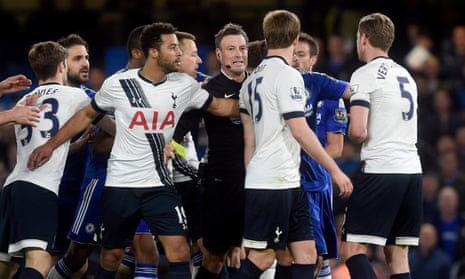 Mark Clattenburg issues a yellow card during an ill-tempered night at Chelsea on which he says he could have sent off three Tottenham players.