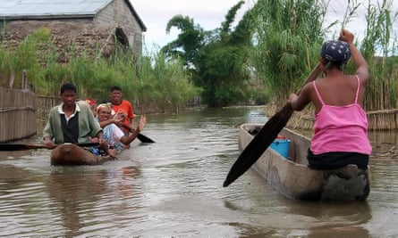 Residents of Anaroro (approximately 150 km northeast of Antananarivo) paddle through the heavily flooded streets of their village on March, 2 2008