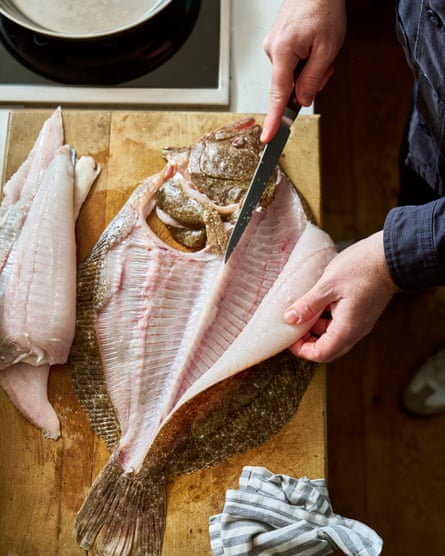 Nathan Outlaw fillets the brill with a chef’s knife.