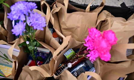 Welcome packs made by supporters for distribution to the first asylum seekers arriving to board the Bibby Stockholm accommodation barge – brown paper bags with items including flowers, cards, toothpaste, shampoo and other toiletry items