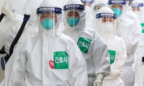South Korean nurses entering a coronavirus ward at Dongsan hospital, Daegu.