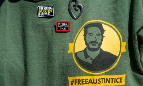 The t-shirt and pins worn by Debra Tice, mother of Austin Tice, during the unveiling of a #BRINGAUSTINHOME banner hanging from the Washington Post headquarters building in Washington DC this month.