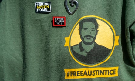 The T-shirt and pins worn by Debra Tice during the unveiling of a #BringAustinHome banner hanging in Washington DC.