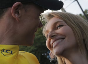 Chris Froome of Britain is kissed by his wife Michelle after his win on the Champs-Elysees.