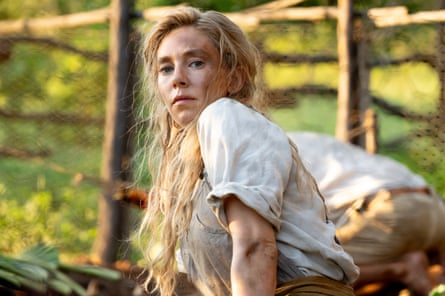 woman sitting outside looks ahead