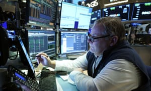Trader Michael Conlon on the floor of the New York Stock Exchange on Wednesday, as Wall Street's jolting roller-coaster ride continued.