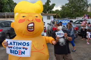 Masked while protesting. Joe Biden supporters in Little Havana, Miami, demonstrate against Donald Trump’s visit to south Florida yesterday, when he barely mentioned coronavirus despite record cases and deaths in the state and the situation there worsening.