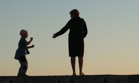 Silhouette of a woman and a child in the evening.