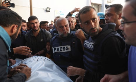 Al Jazeera journalist Wael Al-Dahdouh attends the funeral of his son, Palestinian journalist Hamza Al-Dahdouh, after Hamza was killed in an Israeli strike in Rafah in the southern Gaza Strip.