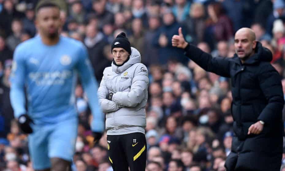 Thomas Tuchel watches Pep Guardiola gesture to Manchester City's players during Chelsea's 1-0 defeat at the Etihad Stadium