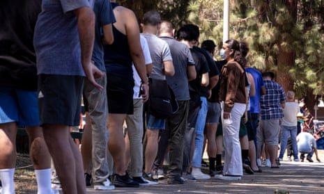People wait in line to get vaccinated against monkeypox in Los Angeles, California.