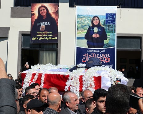 Mourners carry the coffin of Lebanese journalist Amal Khalil during her funeral procession in the village of Baisariyah, southern Lebanon, on Thursday