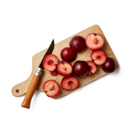 Cut the plums in half. Felicity Cloake’s clafoutis 02a