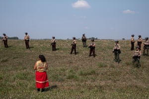 Taysha Martineau of Fond du Lac stands alone in front of a police line during a ceremony. The American Indian Religious Freedom Act grants Native Americans the right to worship through ceremonies and traditional rites but Anishinaabe leaders were regularly interrupted by law enforcement officers while engaged in ceremonies on land that fell in the Line 3 pipeline’s path. Half an hour after this image was taken on 23 July 2021, Martineau was arrested