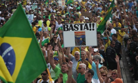 A sign reads ‘Basta!!’ (Enough!!) as thousands of demonstrators pack the Copacabana beach calling for the impeachment of President Dilma Rousseff.