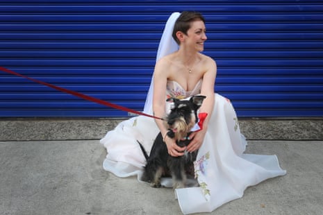 Alice pats her pet schnauzer Rudi before getting married to Jordan.