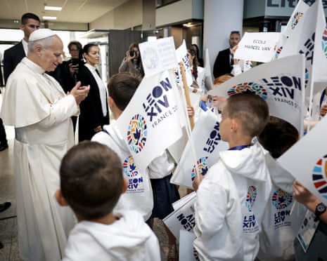 Pope Leo XIV is welcomed by a children's choir upon arrival at the Metz–Nancy–Lorraine Airport, in Metz.