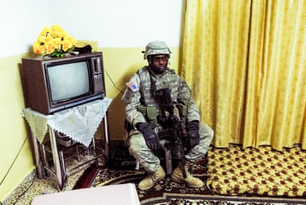 Rawa, Iraq, 2006. Sergeant Jackson rests in the living room while his platoon searches the rest of the house for a suspected insurgent. They found nothing suspicious, and the commander assumed he had received bad intelligence. Most of the raids I witnessed were dry holes.