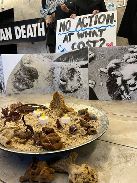 A plate full of sand and candles.