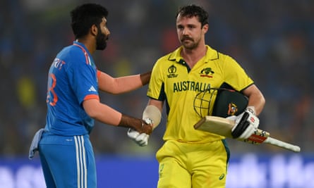 Travis Head of Australia shakes hands with Jasprit Bumrah of India as he leaves the field after being dismissed for 137 runs.