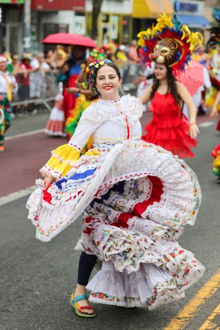 a woman dances in a traditional dress