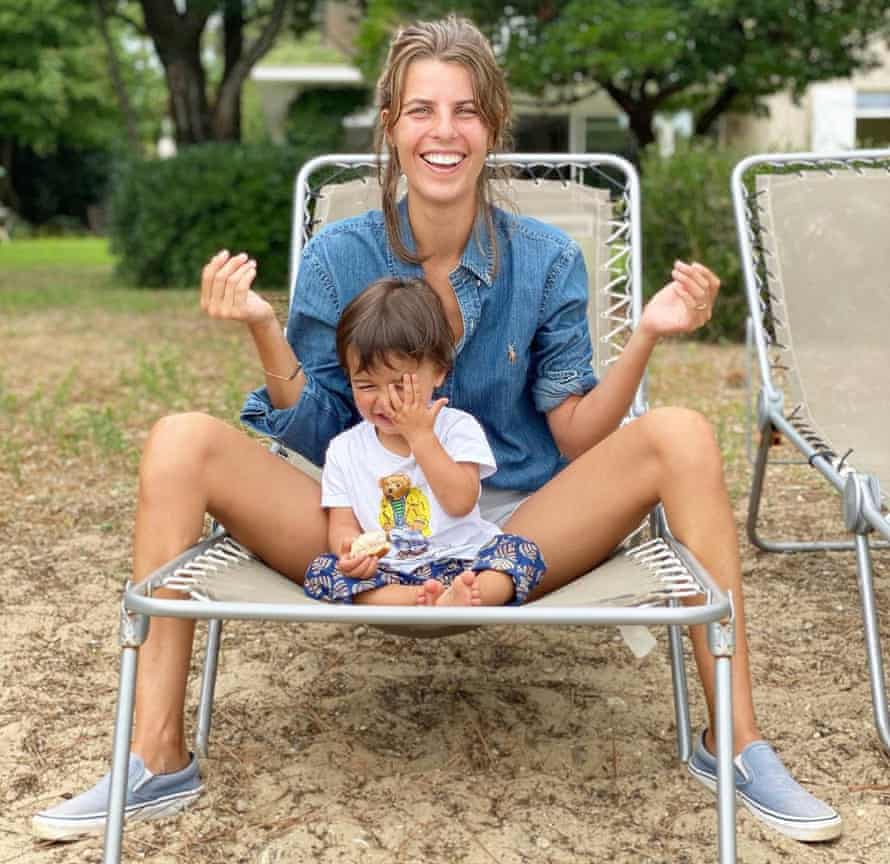 A mum and child on an outdoor chair