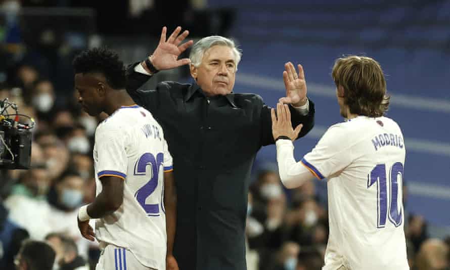 Carlo Ancelotti celebrates with Luka Modric after the 4-1 win over Real Sociedad.