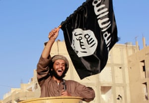 June 2014: An Isis fighter in Raqqa province celebrates after the group’s capture of territory in Iraq leads it to declare a worldwide Islamic ‘caliphate’