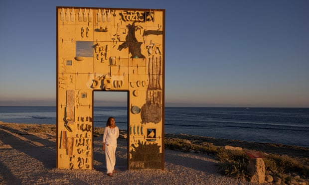 Giusy Nicolini, former major of Lampedusa, besides a monument by Italian artist Mimmo Paladino dedicated to the memory of those migrants who lost their lives attempting to reach Europe.