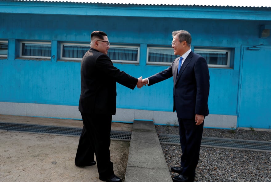 Moon Jae-in and Kim Jong-un shake hands
