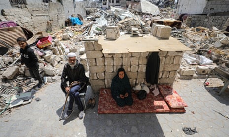 A Palestinian family continue to live in the rubble of their destroyed house in Gaza City, 7 April 2024.