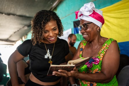 Regina Miranda shows a book of Afro-inspired poems related to San Basilio de Palenque