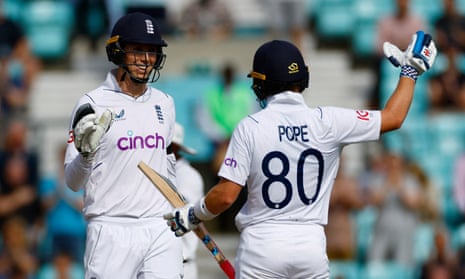 Zak Crawley celebrates with Ollie Pope after hitting the winning runs for England. 