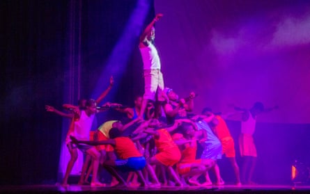 A man being lifted high up by a crowd