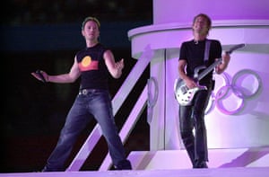 Band Savage Garden performing at the closing ceremony. One member is wearing an Aboriginal flag shirt and the other is playing guitar
