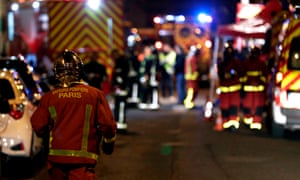 Firefighters at the apartment building that caught fire in the 16th arrondissement of Paris.